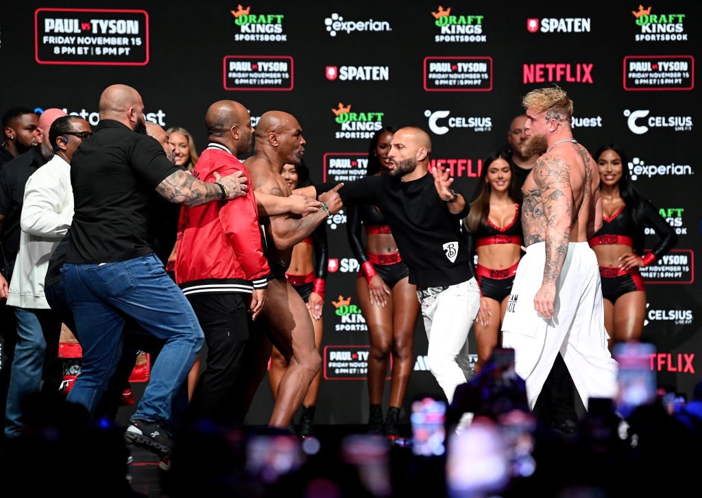 Mike Tyson and Jake Paul had to be seperated by security and MVP promotions co-founder Nakisa Bidarian during weigh-ins.Credit: Stephen McCarthy / Getty