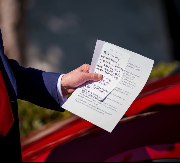 Trump was seen holding a handwritten note with a full price breakdown. Credit:  Andrew Harnik/Getty Images