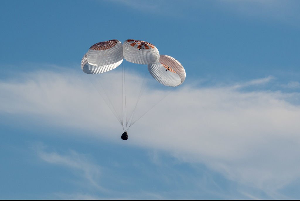 After 17 hours, the crew splashes down. Credit: Keegan Barber/NASA via Getty Images)