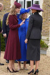 A lipreader has revealed what Kate Middleton said to Melania Trump.