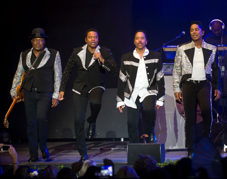 The Jacksons - Tito recognizable by his iconic bowler hat - performing after Michael's death in 2018. Credit: Jordi Vidal / Getty